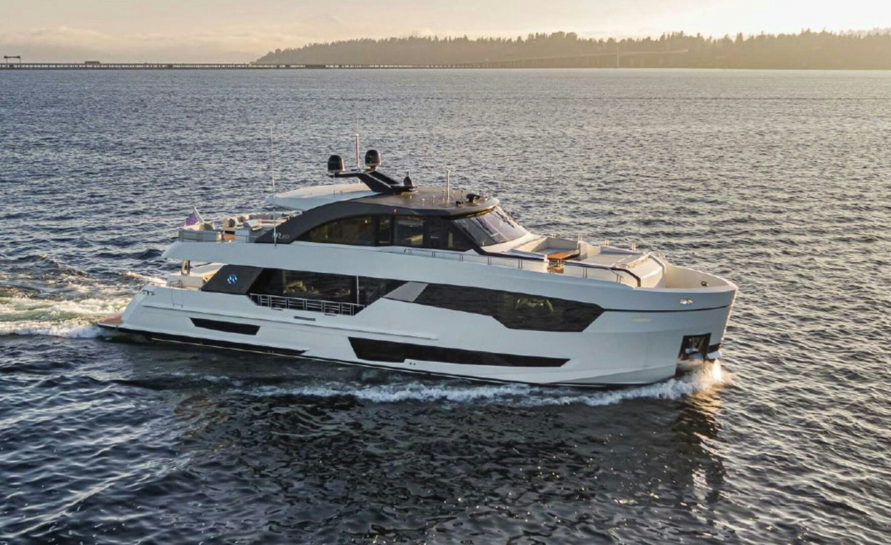 a white yacht on the water aboard TLC Yacht for Sale
