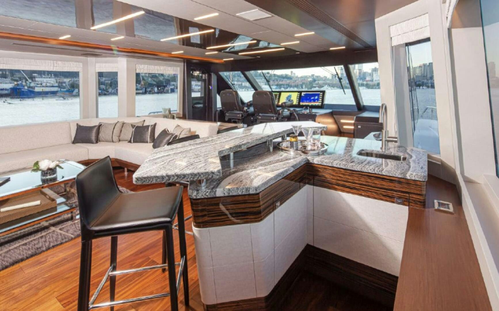 a room with a couch and a table aboard TLC Yacht for Sale