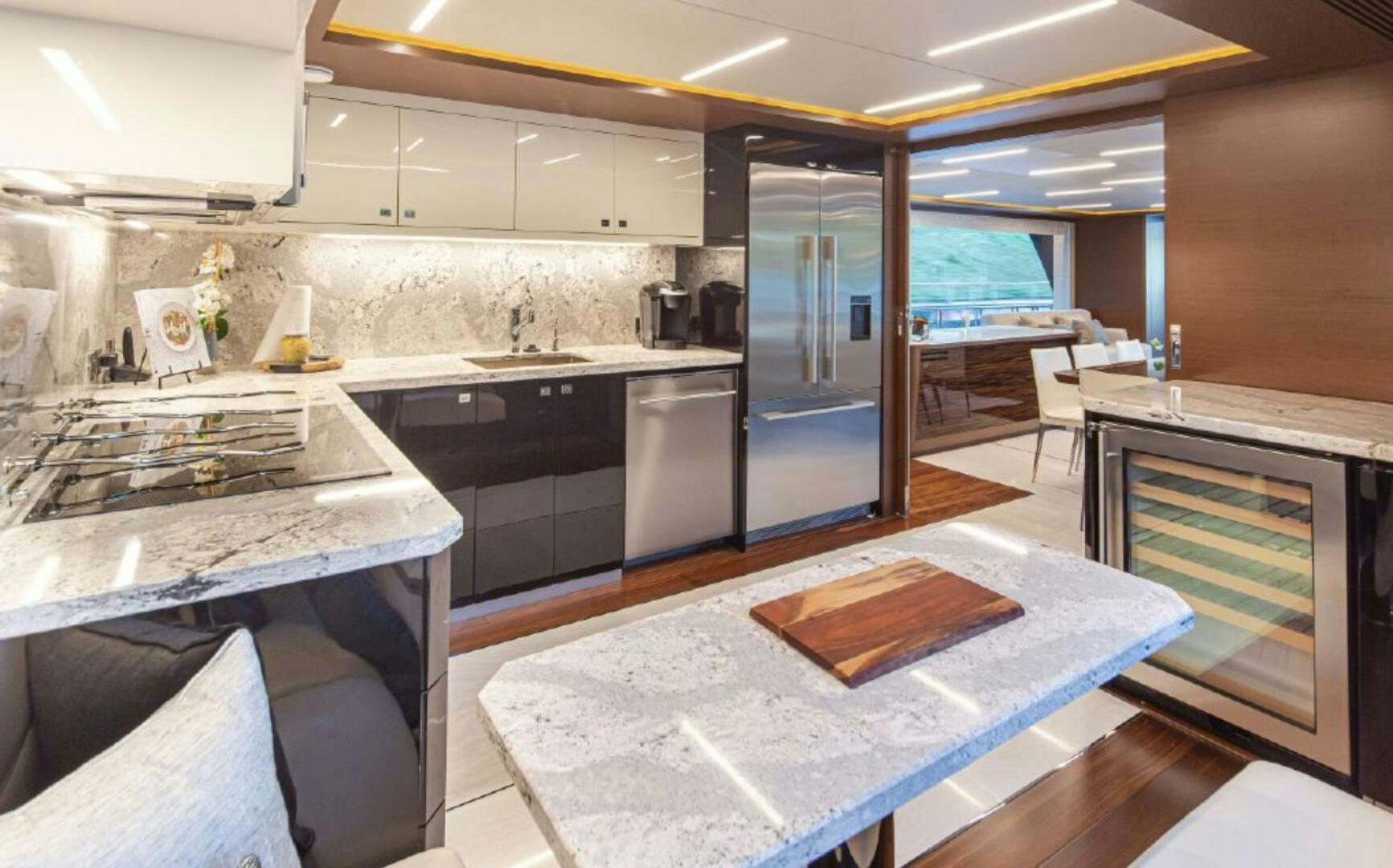 a kitchen with a large island aboard TLC Yacht for Sale