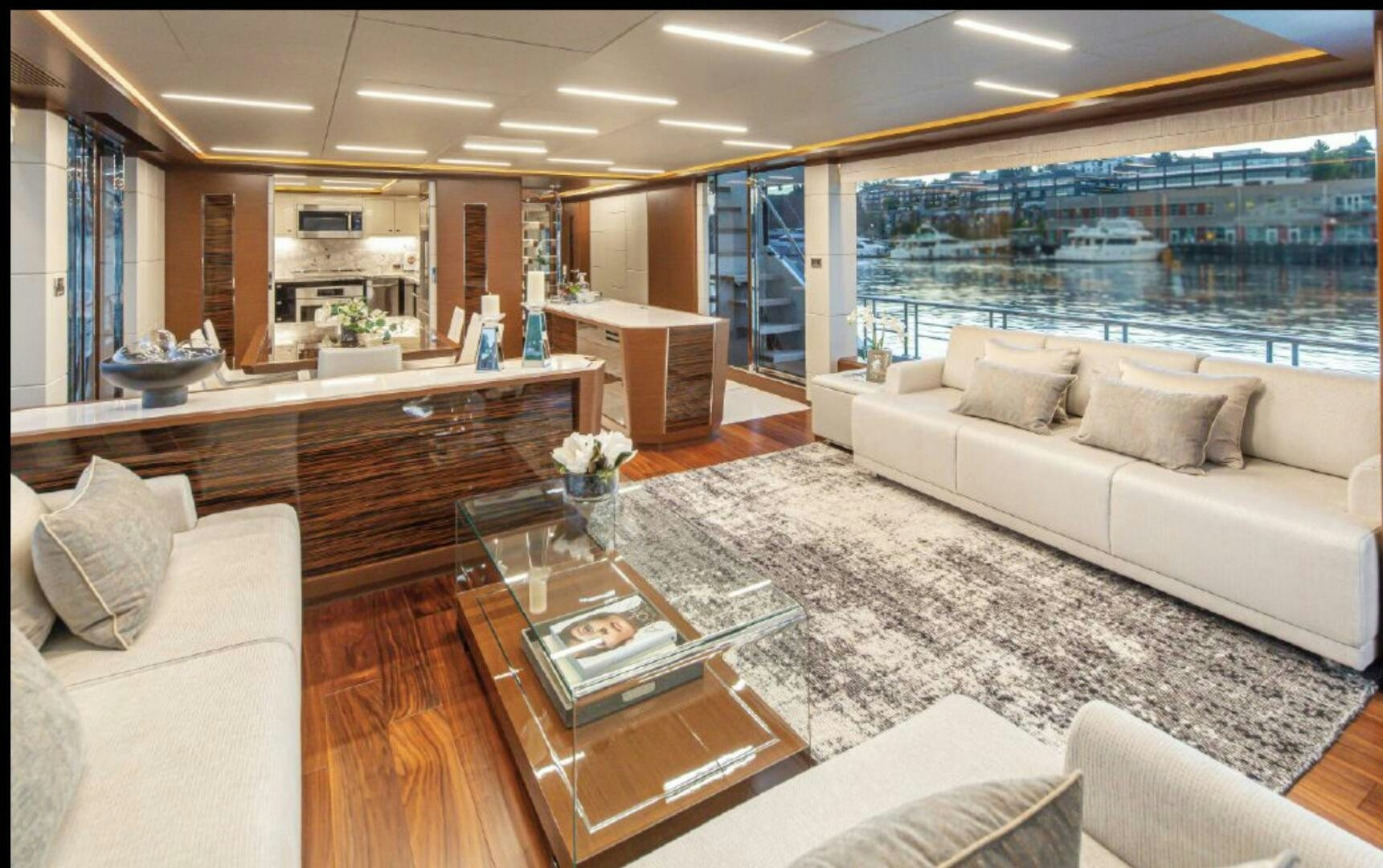 a living room with a large window aboard TLC Yacht for Sale