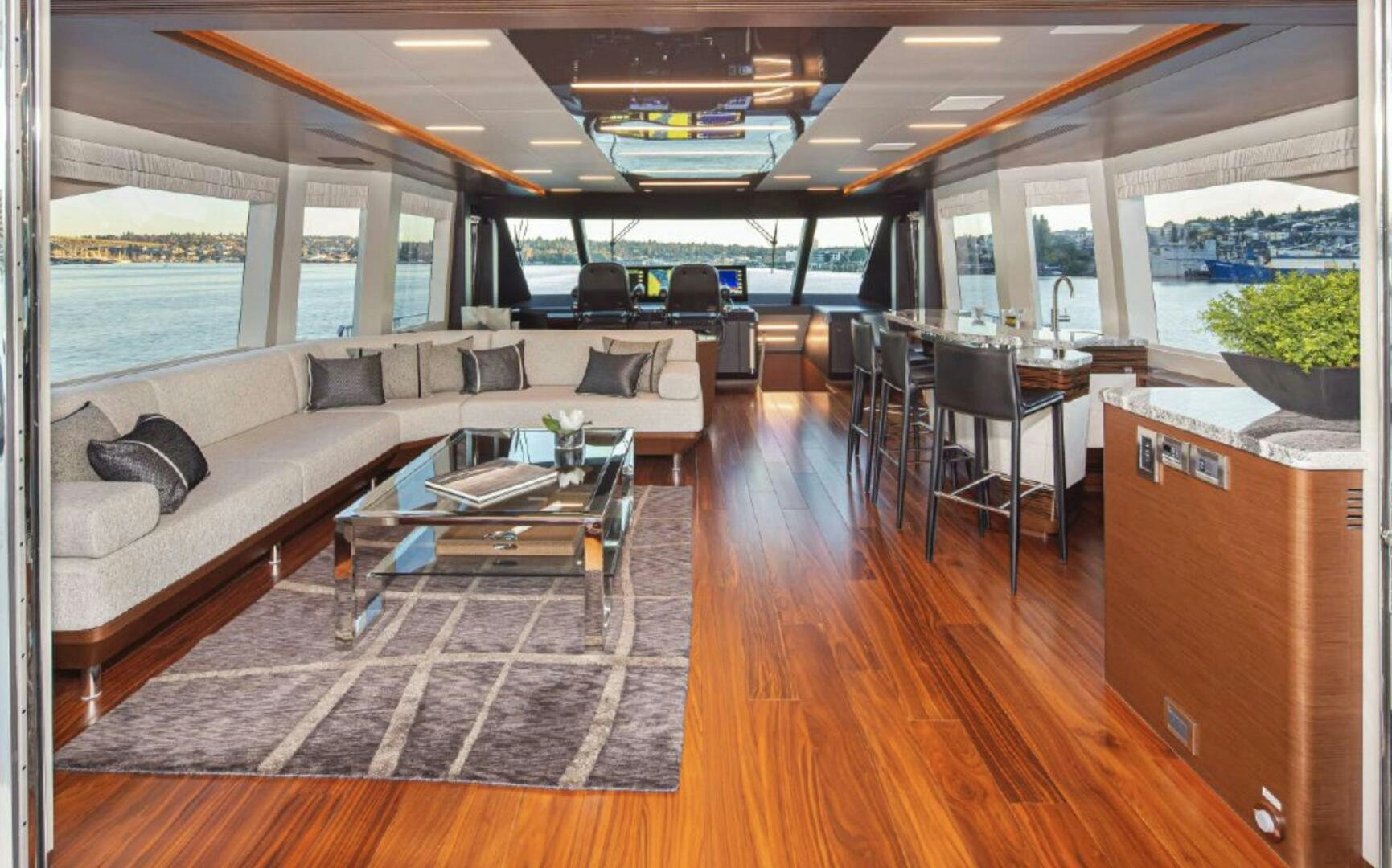 a living room with a couch and a table aboard TLC Yacht for Sale