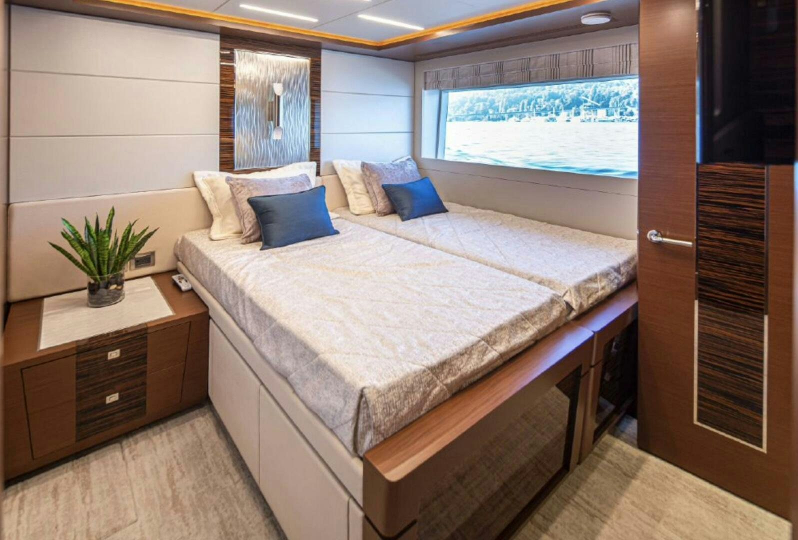 a bed in a room aboard TLC Yacht for Sale
