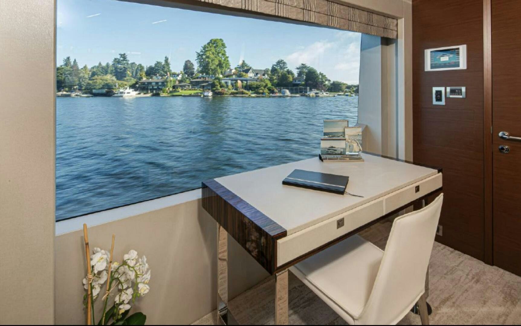 a table with a laptop on it aboard TLC Yacht for Sale