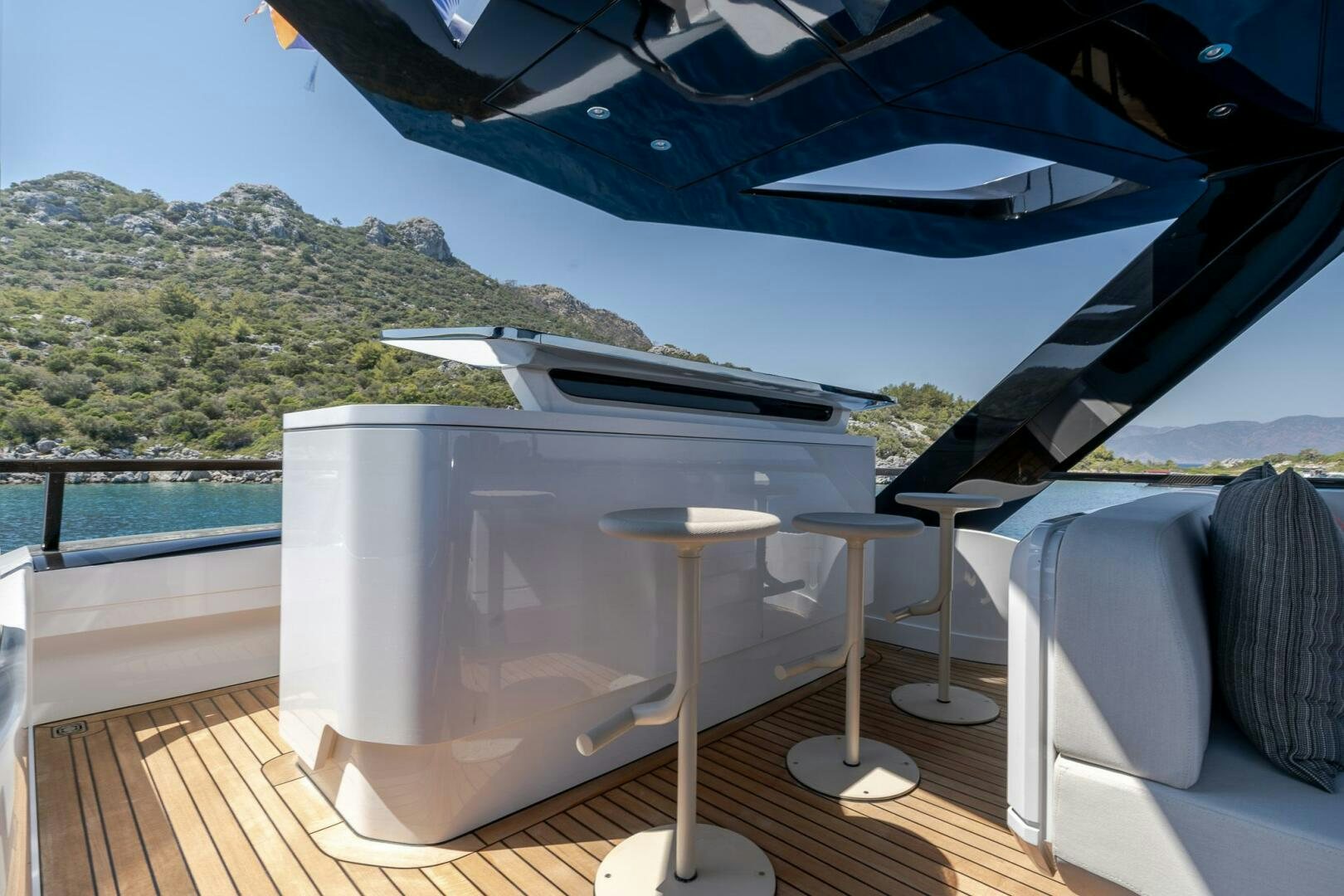 a table on a deck aboard EDGE Yacht for Sale