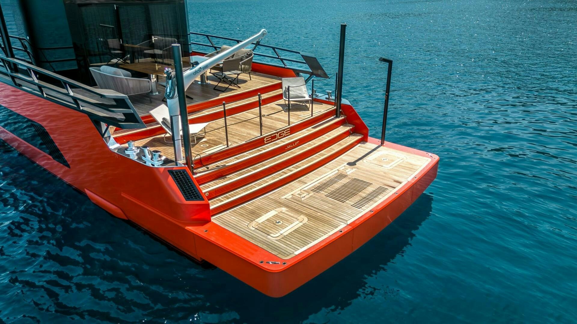 a red and white boat on the water aboard EDGE Yacht for Sale