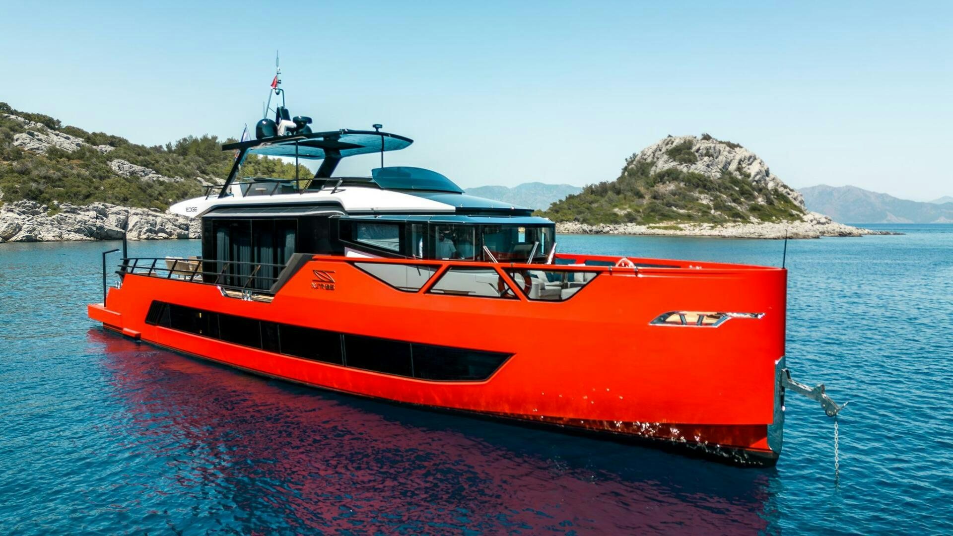 a red and white boat on water aboard EDGE Yacht for Sale
