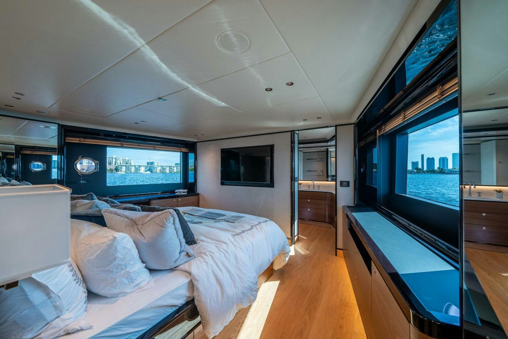 a bedroom with a large tv aboard ALGI Yacht for Sale