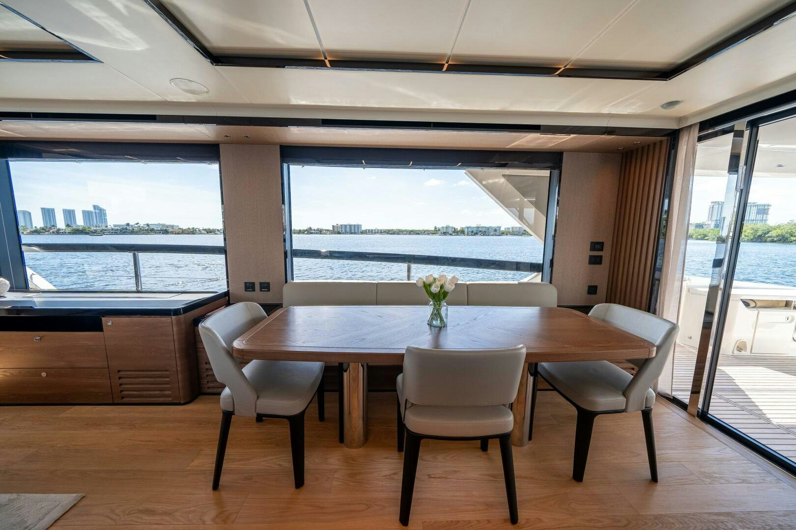a room with a table and chairs aboard ALGI Yacht for Sale