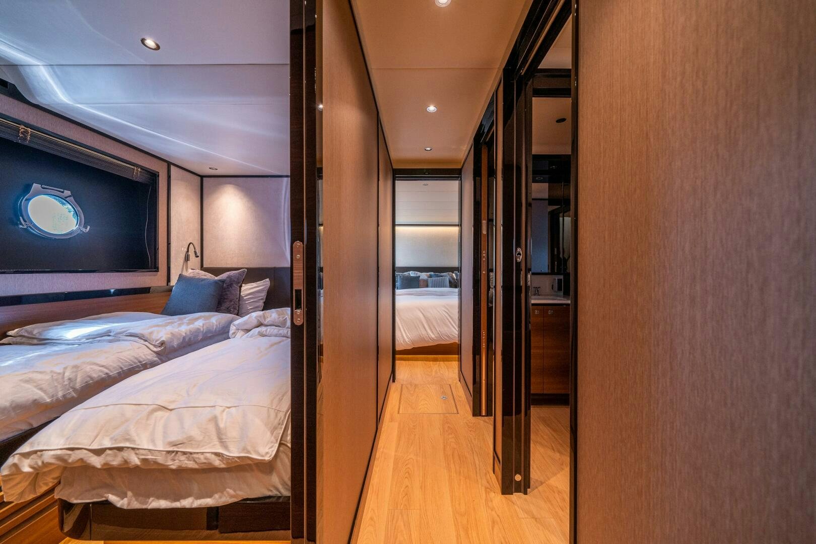 a room with a bed and a tv on the wall aboard ALGI Yacht for Sale