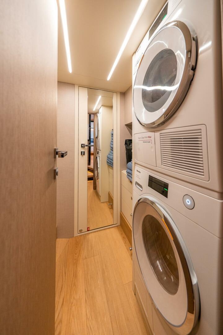 a laundry room with washing machines aboard ALGI Yacht for Sale