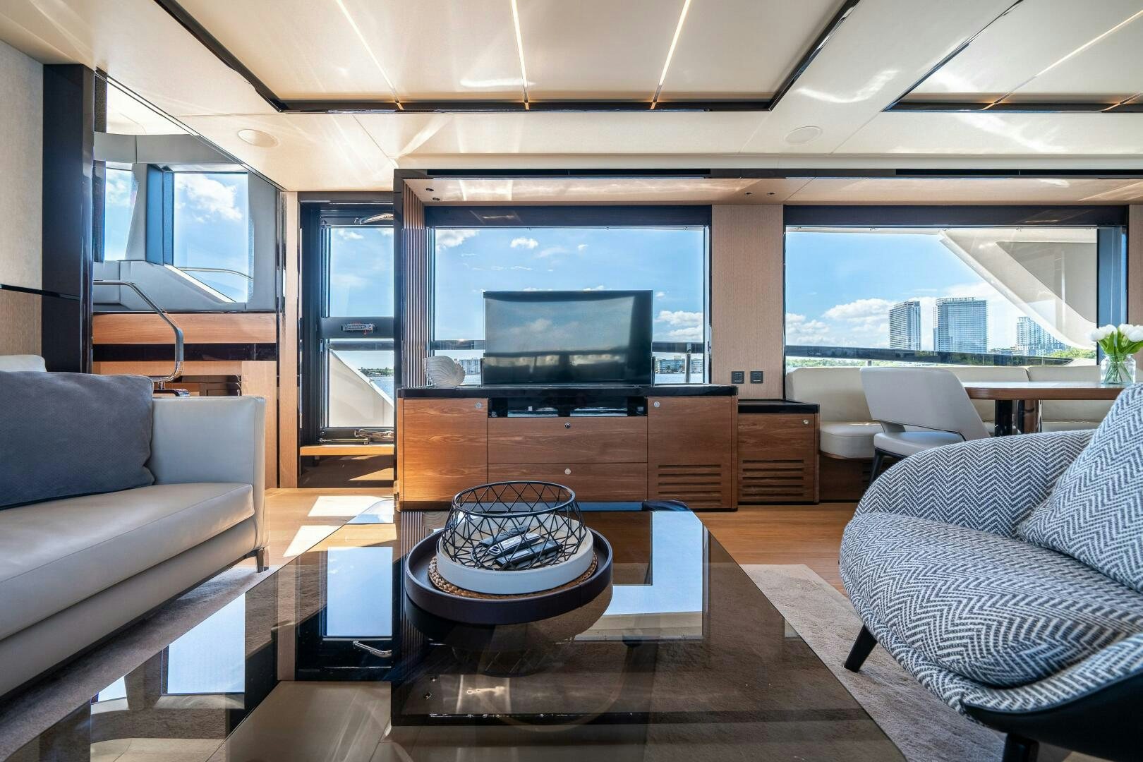 a living room with a large tv aboard ALGI Yacht for Sale