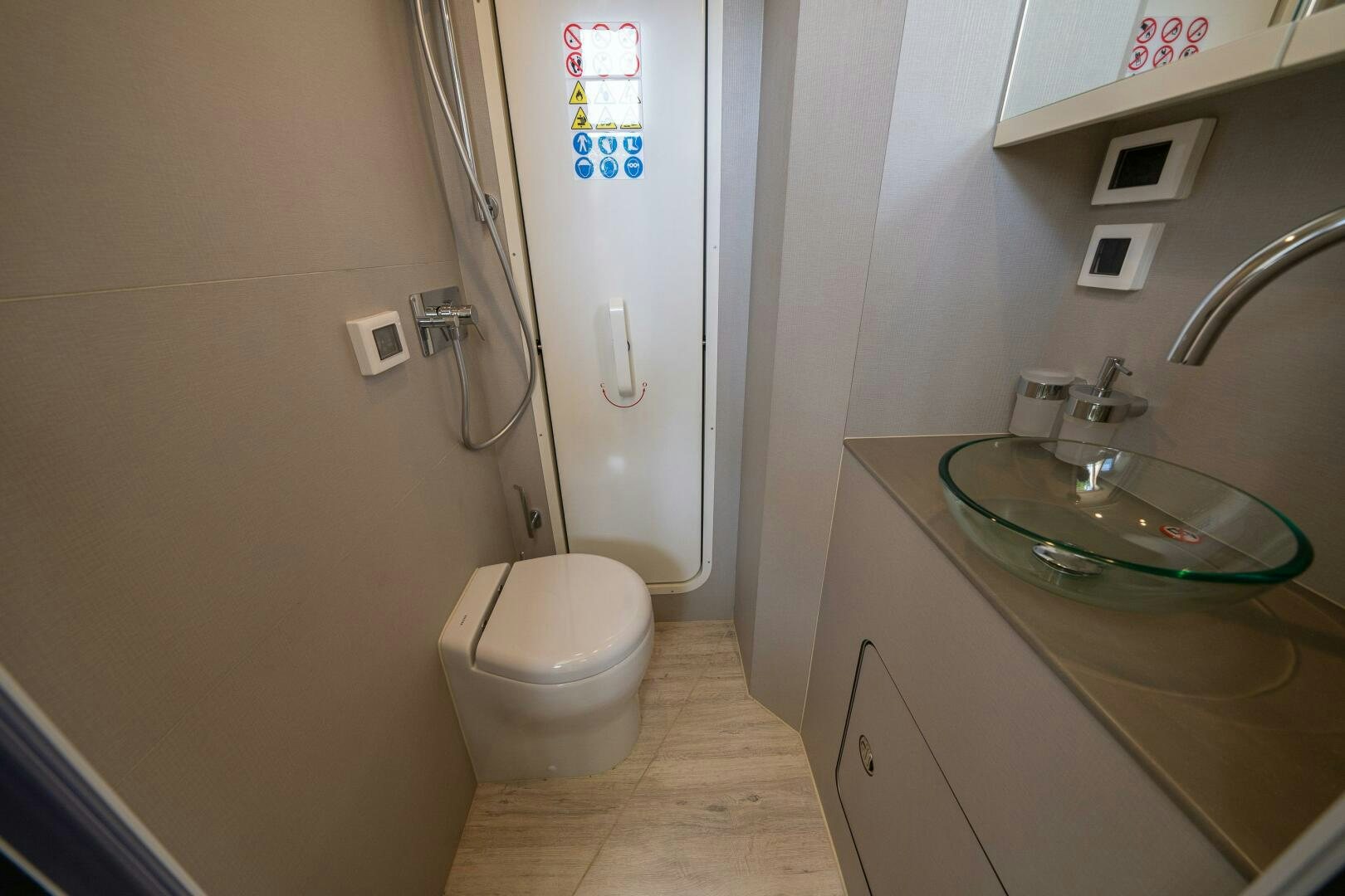 a bathroom with a sink and toilet aboard ALGI Yacht for Sale