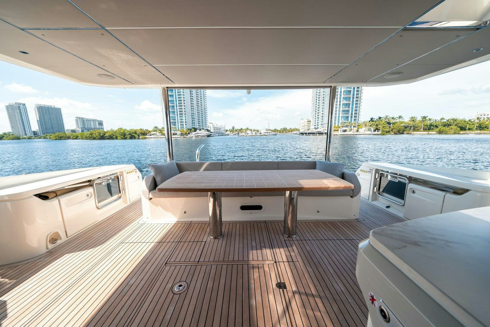 a room with a table and a bed aboard ALGI Yacht for Sale
