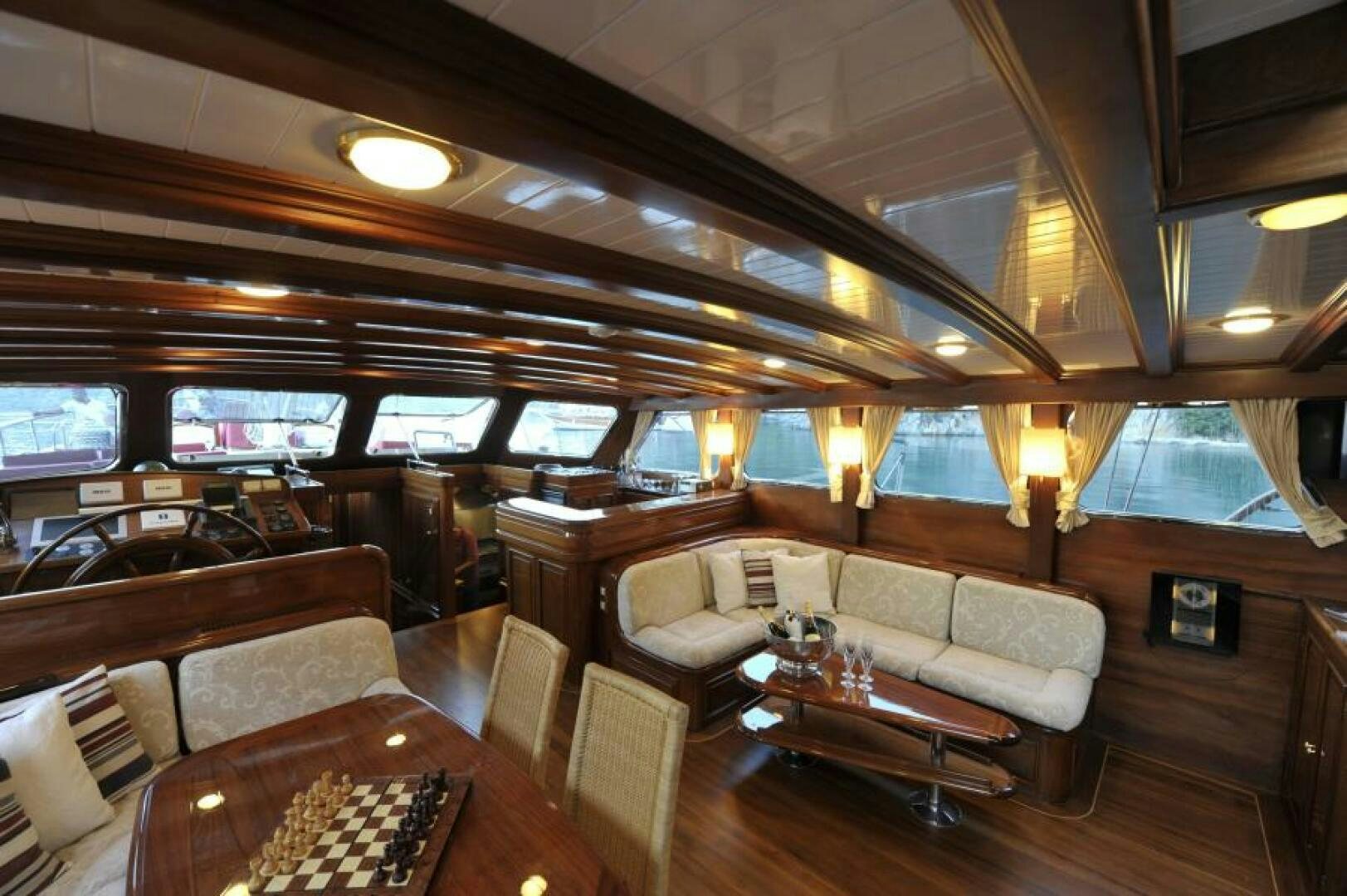 a room with a couch and a table and a television aboard CLARISSA Yacht for Sale