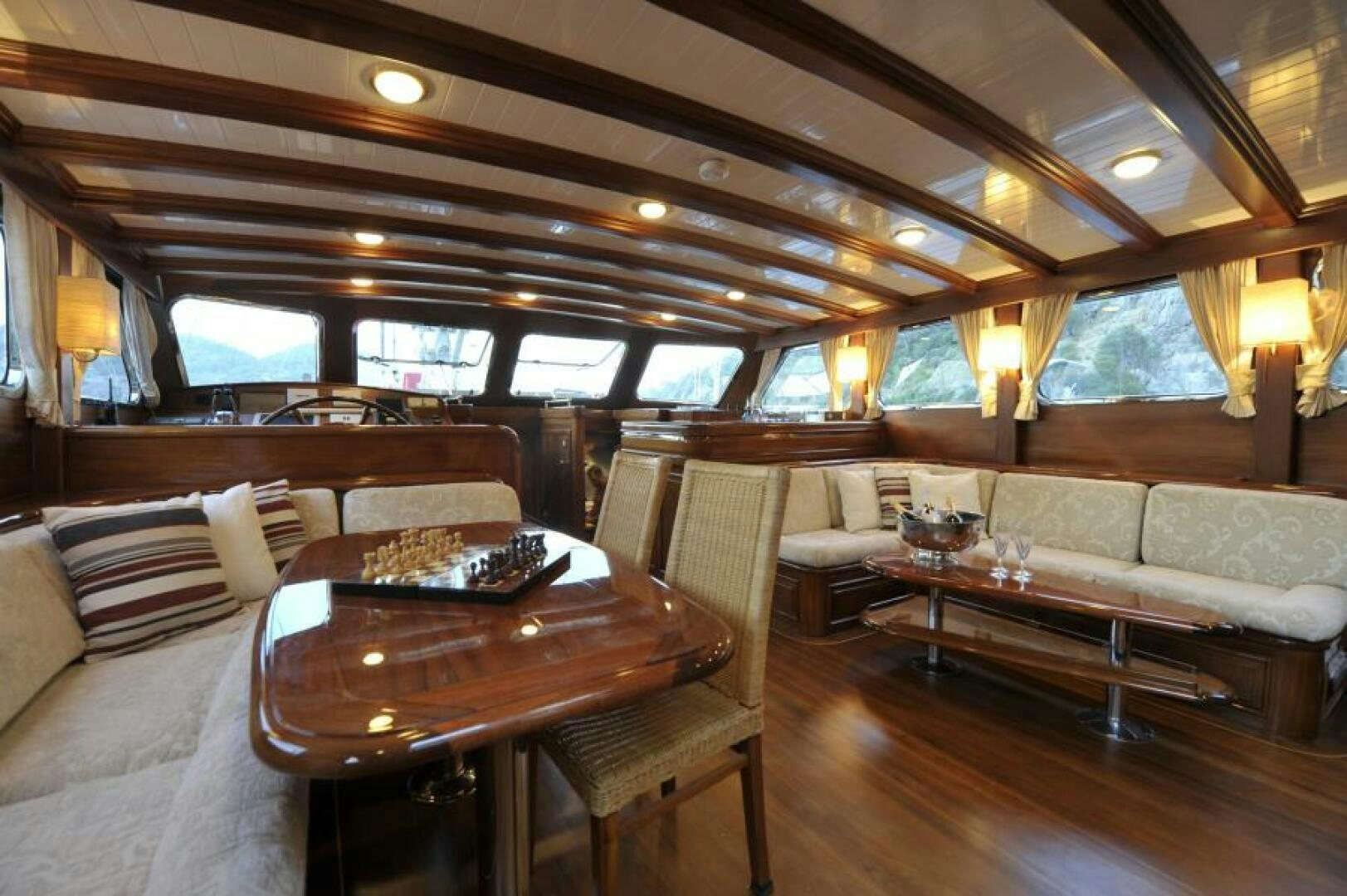 a living room with a couch and a table aboard CLARISSA Yacht for Sale