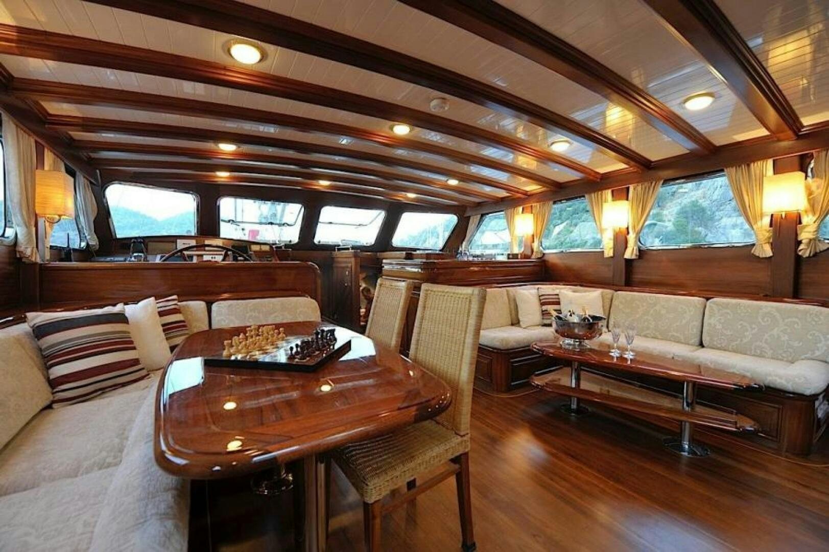 a living room with a couch and a table aboard CLARISSA Yacht for Sale