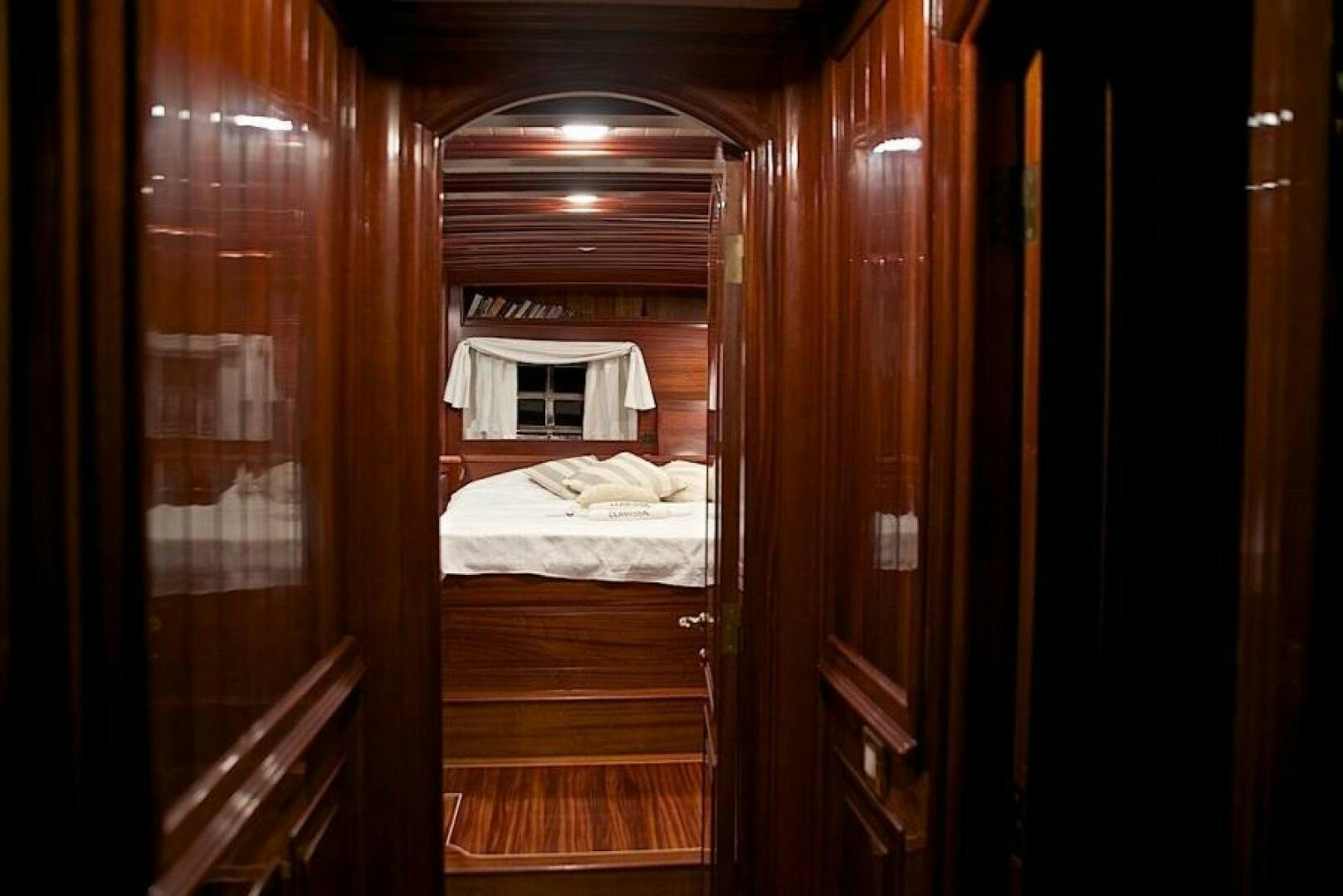 a room with a bed and a window aboard CLARISSA Yacht for Sale