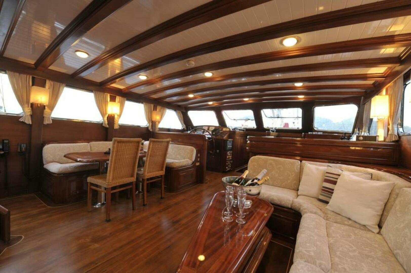 a living room with wood floors aboard CLARISSA Yacht for Sale