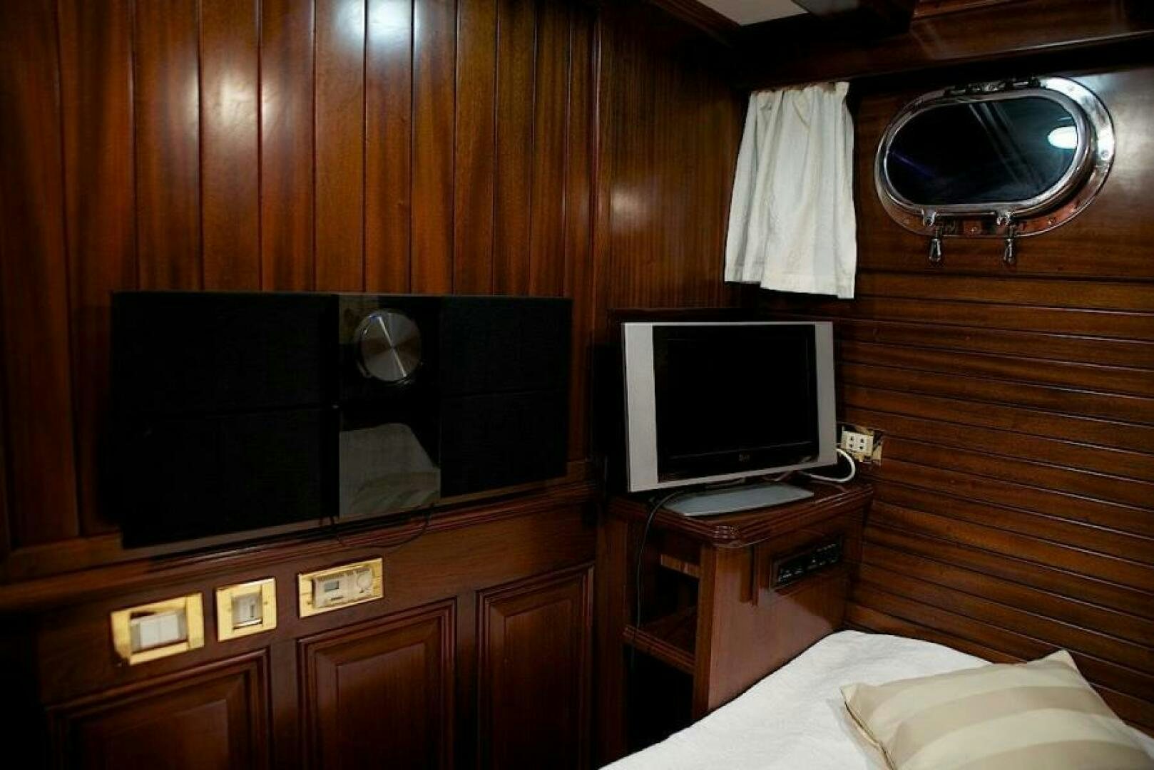 a room with a tv and a bed aboard CLARISSA Yacht for Sale