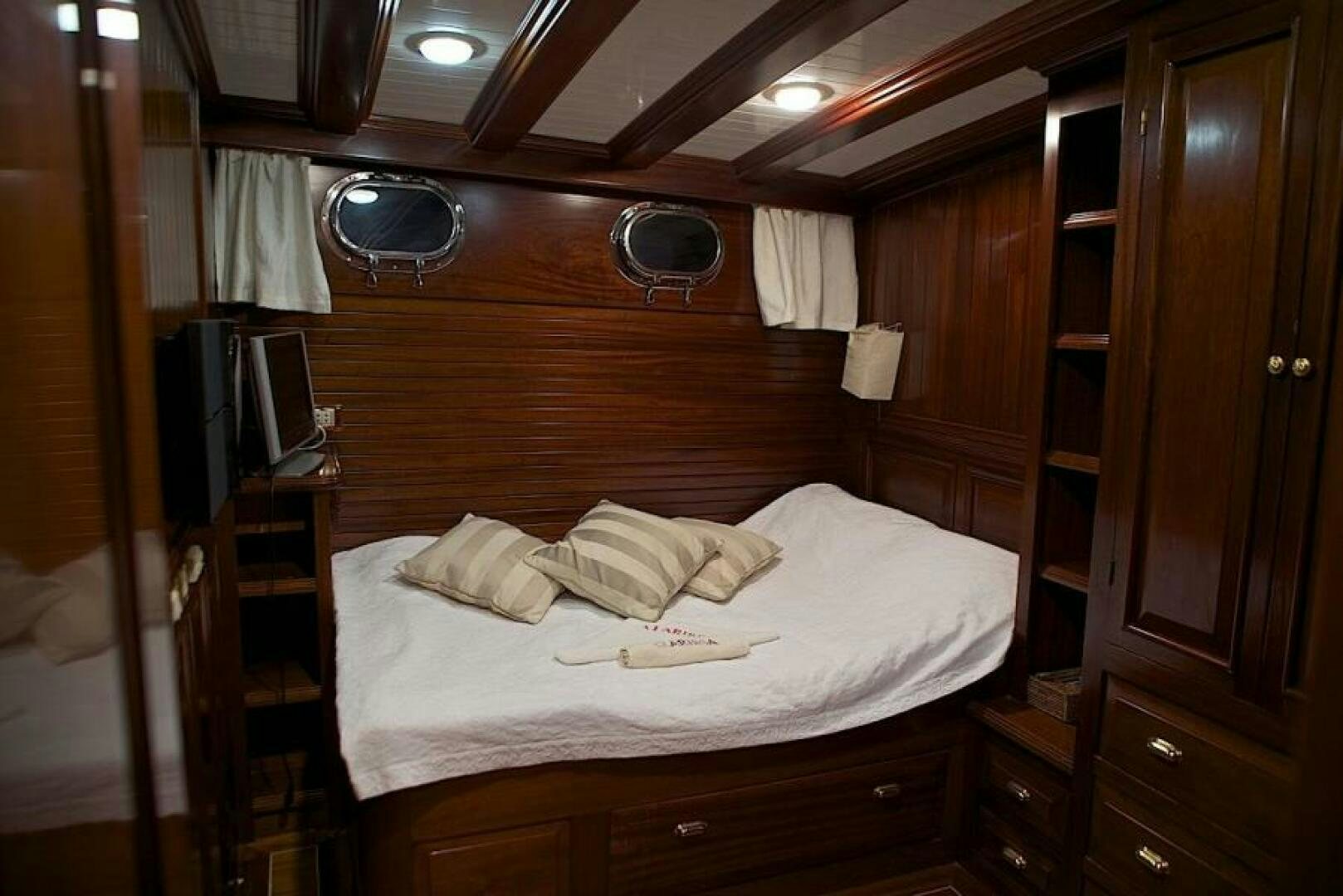 a bed in a room aboard CLARISSA Yacht for Sale