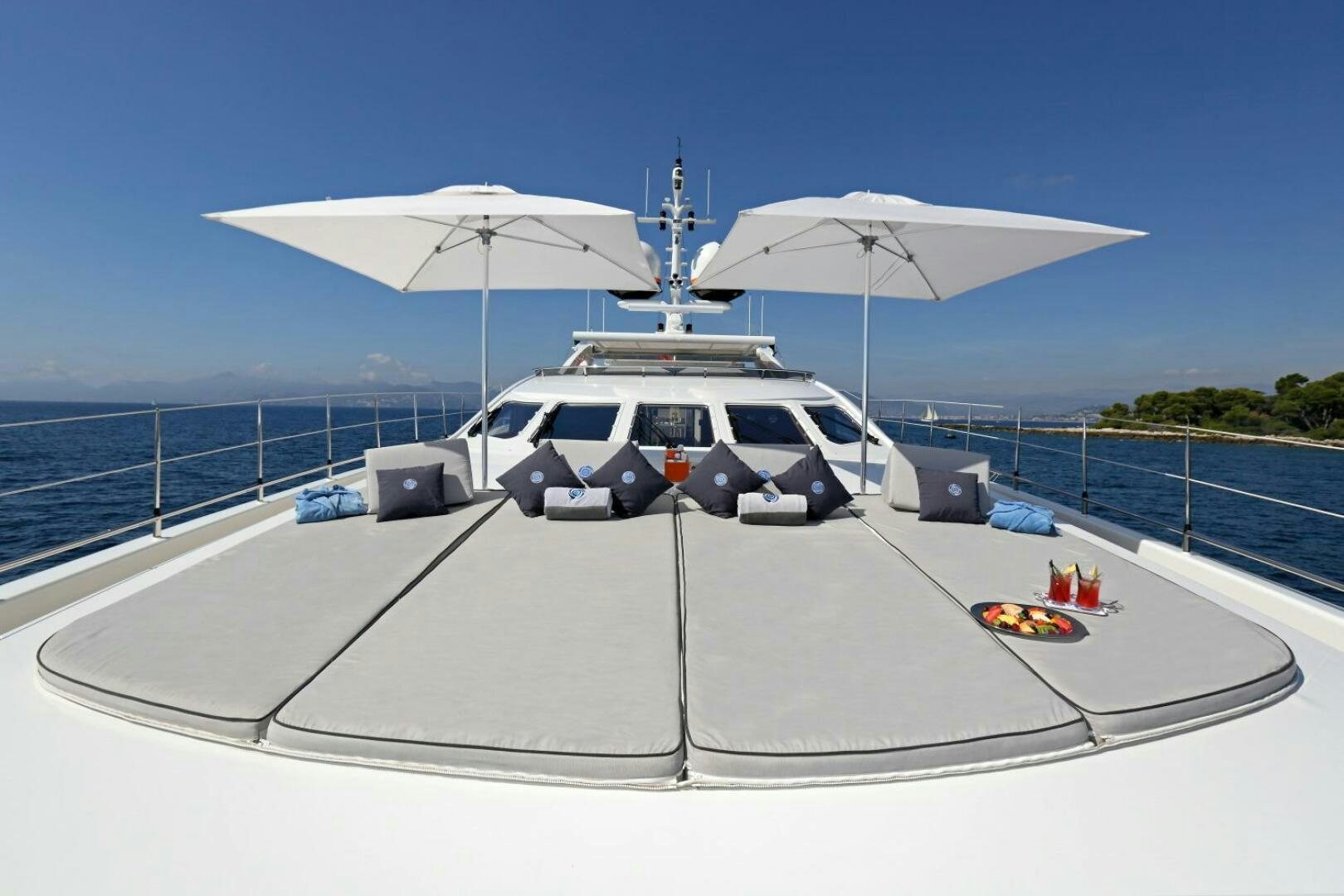 a white car with a white umbrella on top of it aboard AURELIA Yacht for Sale