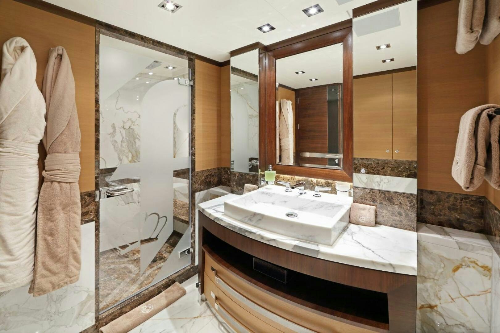 a bathroom with a large mirror aboard AURELIA Yacht for Sale