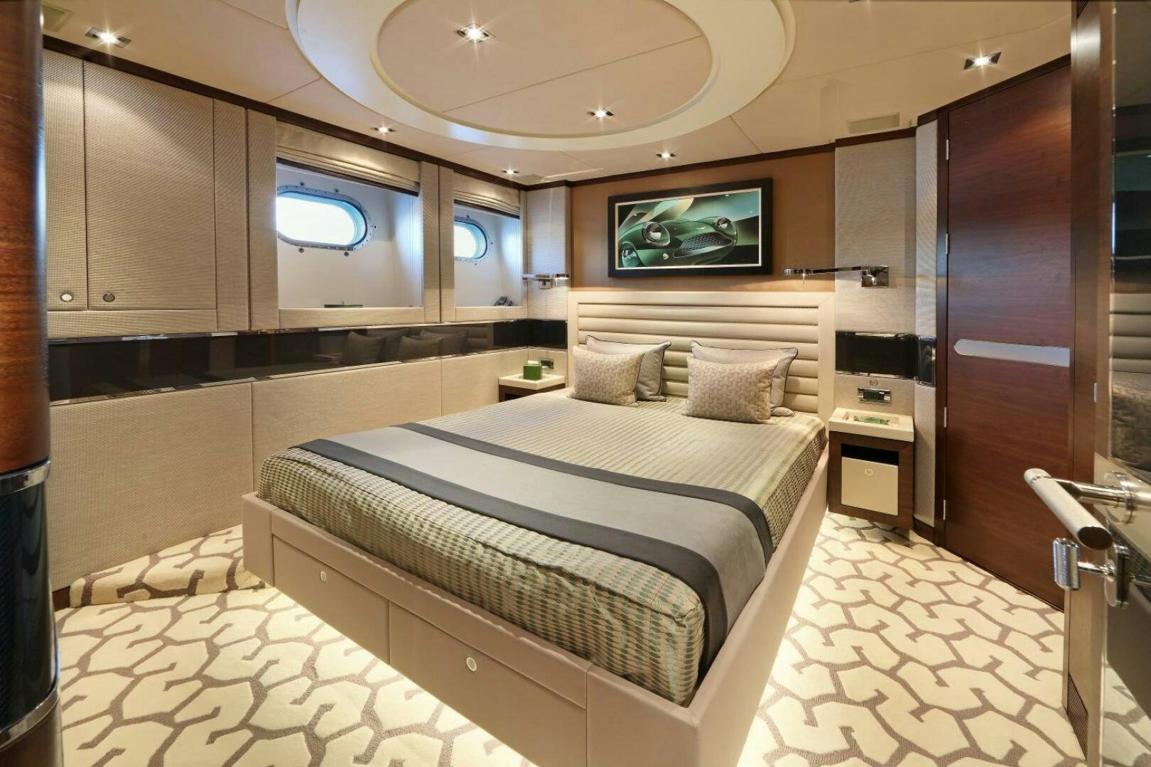 a bedroom with a bed and a television aboard AURELIA Yacht for Sale