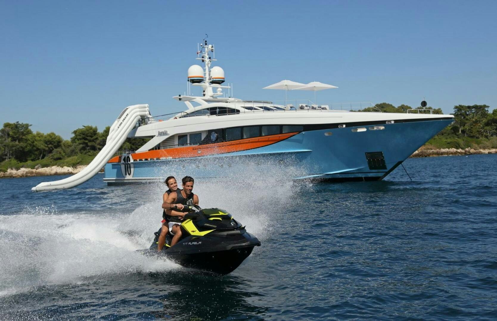 a couple of people on a speed boat in the water aboard AURELIA Yacht for Sale