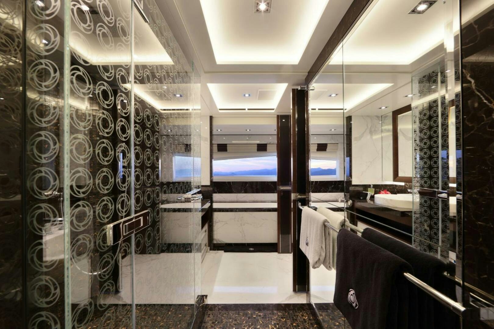 a bathroom with glass walls aboard AURELIA Yacht for Sale