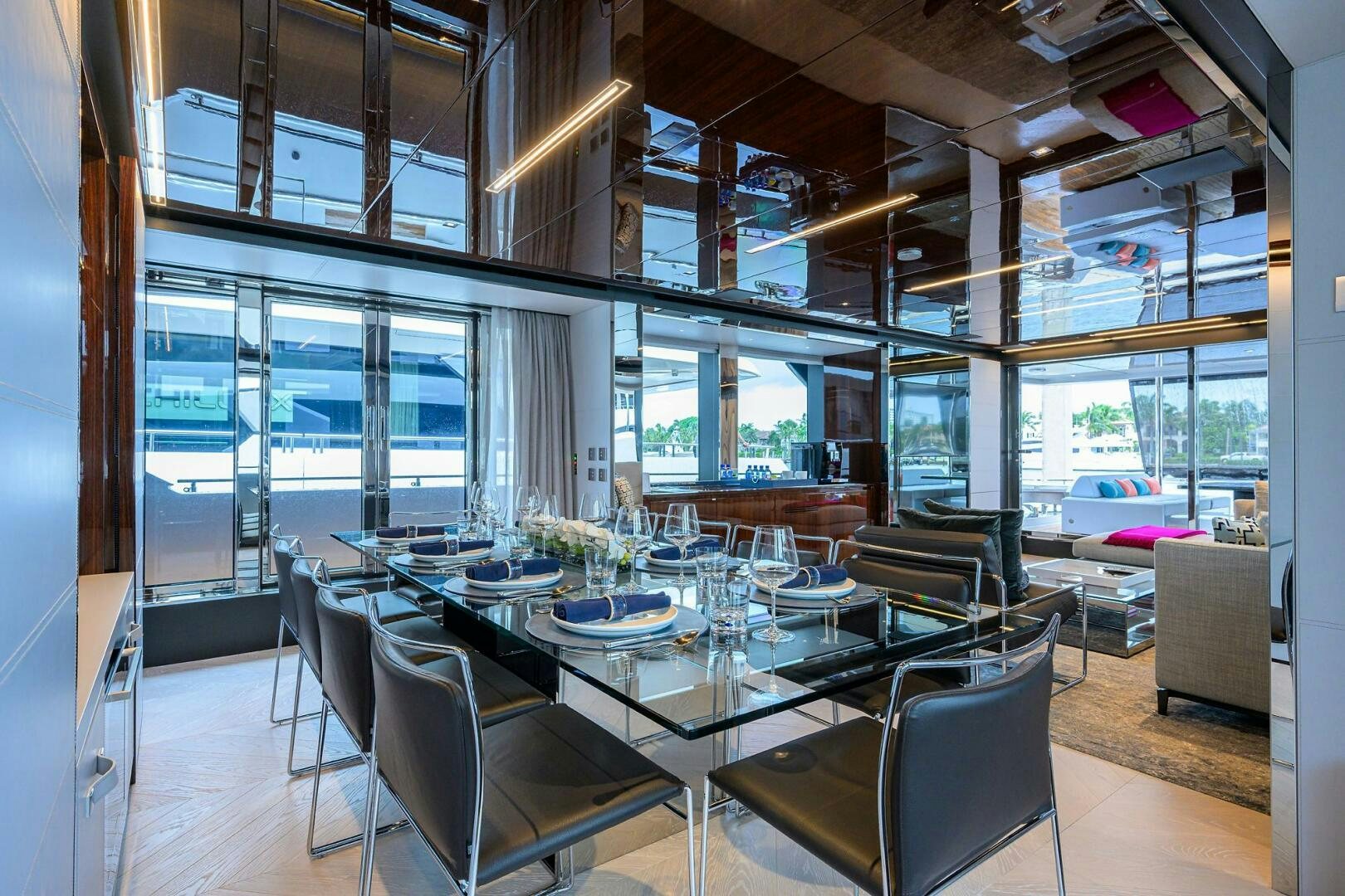 a large room with a table and chairs aboard RISE ABOVE III Yacht for Sale