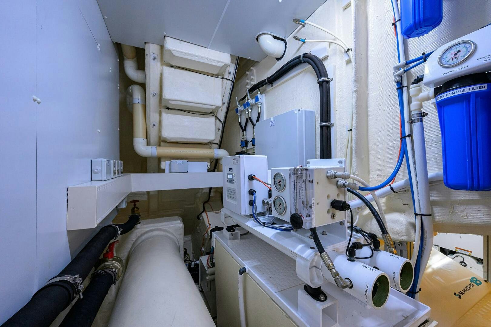 a room with white machines aboard RISE ABOVE III Yacht for Sale
