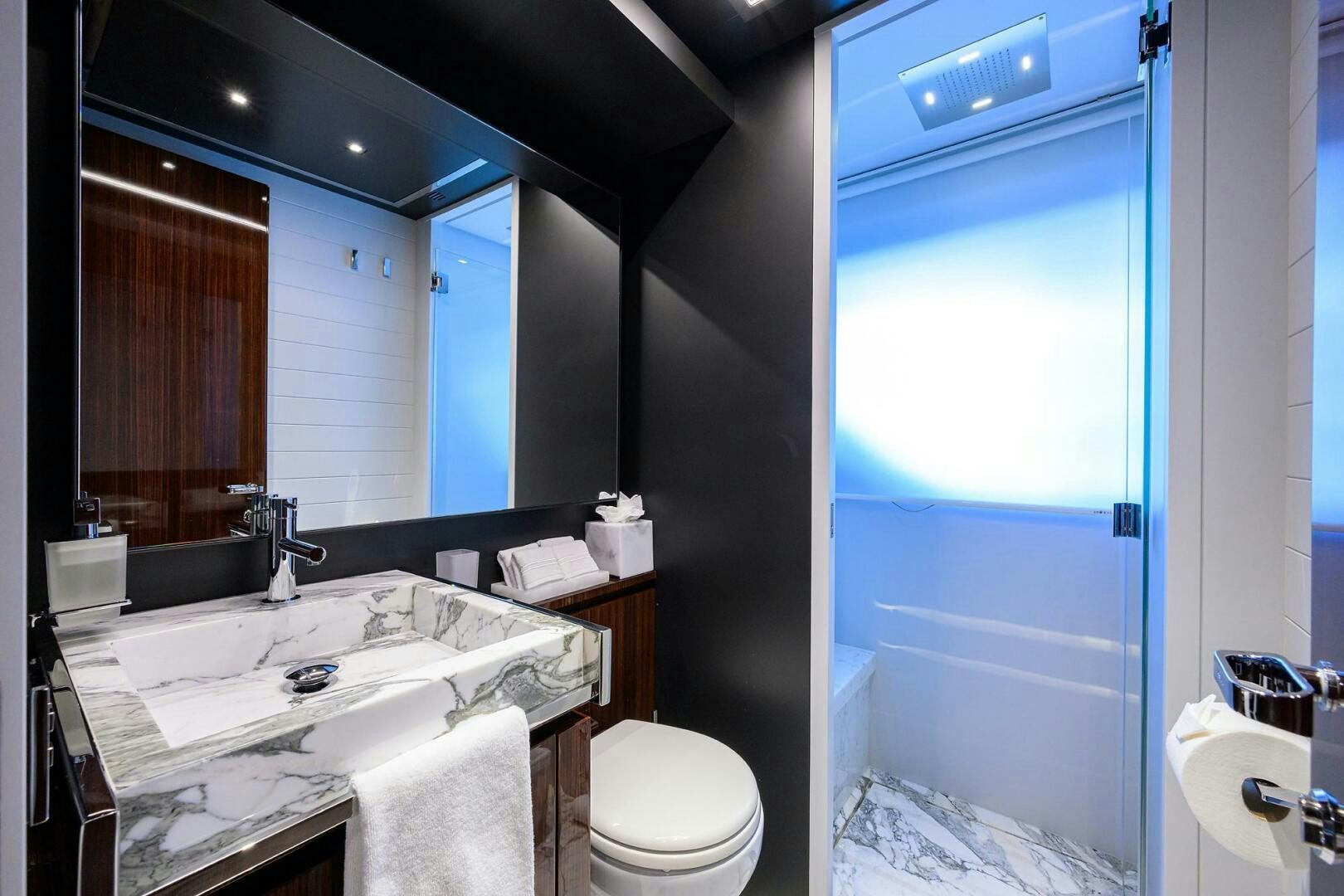 a bathroom with a sink and a toilet aboard RISE ABOVE III Yacht for Sale