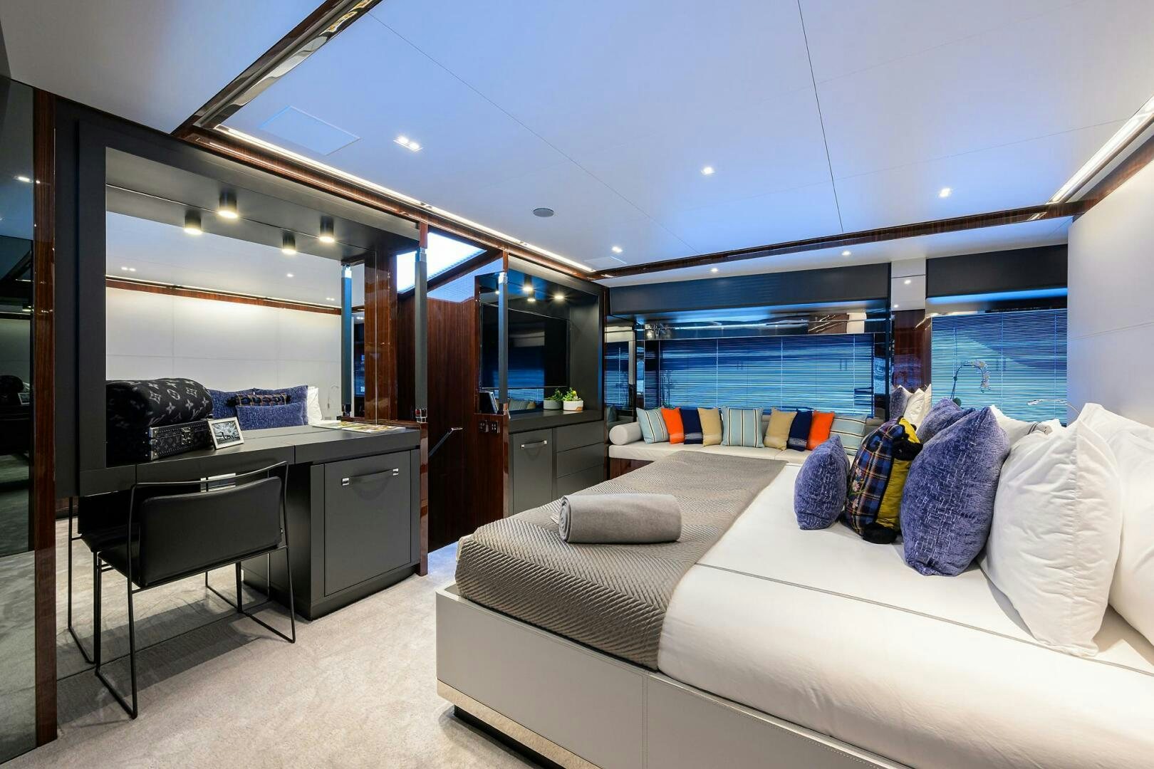 a living room with a couch and a table aboard RISE ABOVE III Yacht for Sale