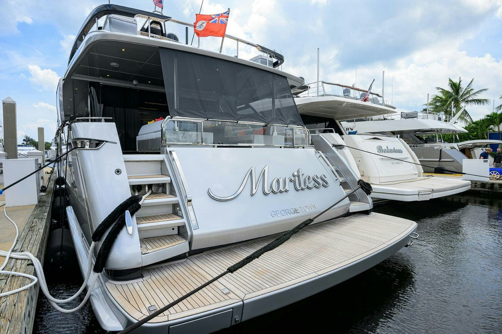 a boat parked on the side of a river aboard RISE ABOVE III Yacht for Sale