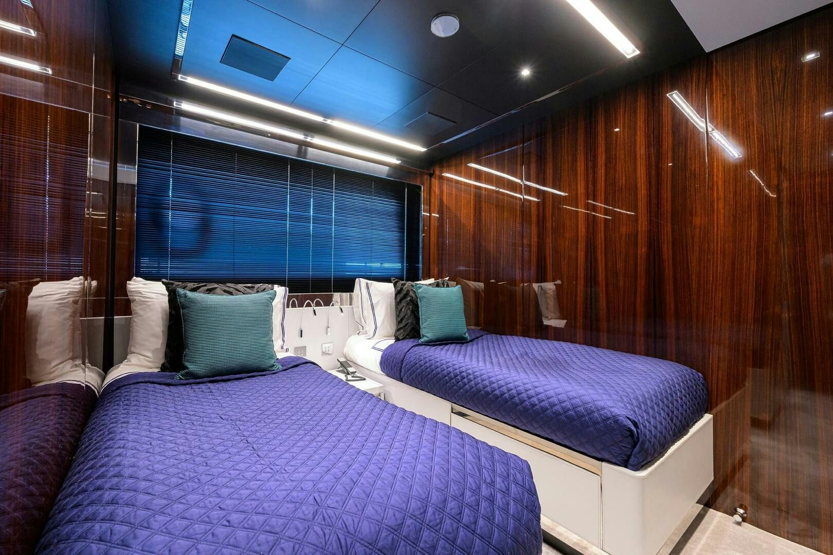 a room with two beds aboard RISE ABOVE III Yacht for Sale