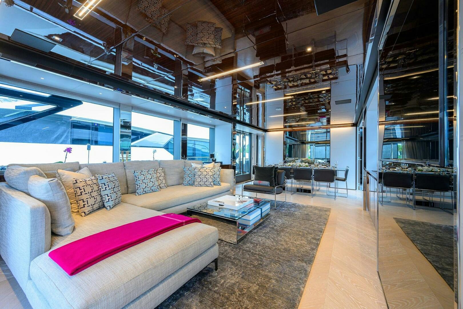 a living room with a large window aboard RISE ABOVE III Yacht for Sale