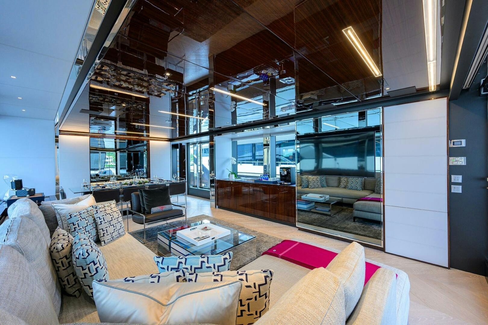 a living room with a large window aboard RISE ABOVE III Yacht for Sale