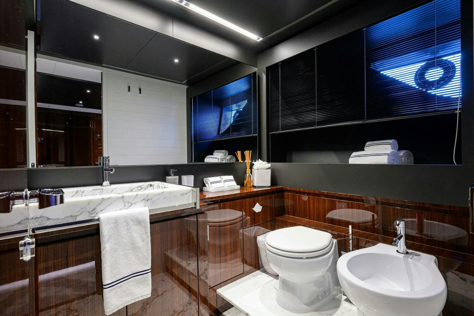 a bathroom with a large window aboard RISE ABOVE III Yacht for Sale