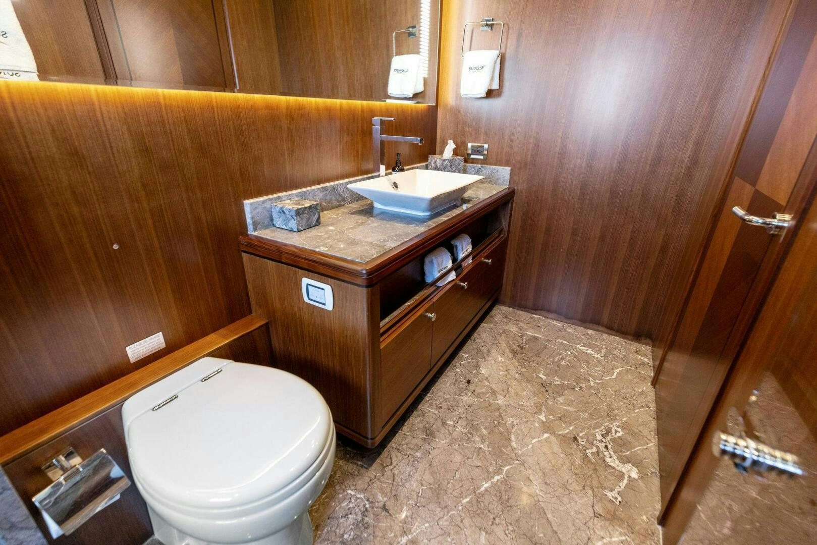 a bathroom with a sink and a toilet aboard SUNZSET Yacht for Sale