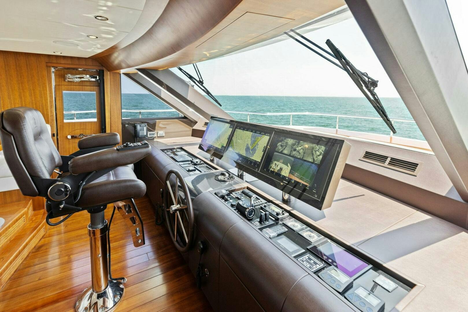 a room with a desk and chairs aboard SUNZSET Yacht for Sale
