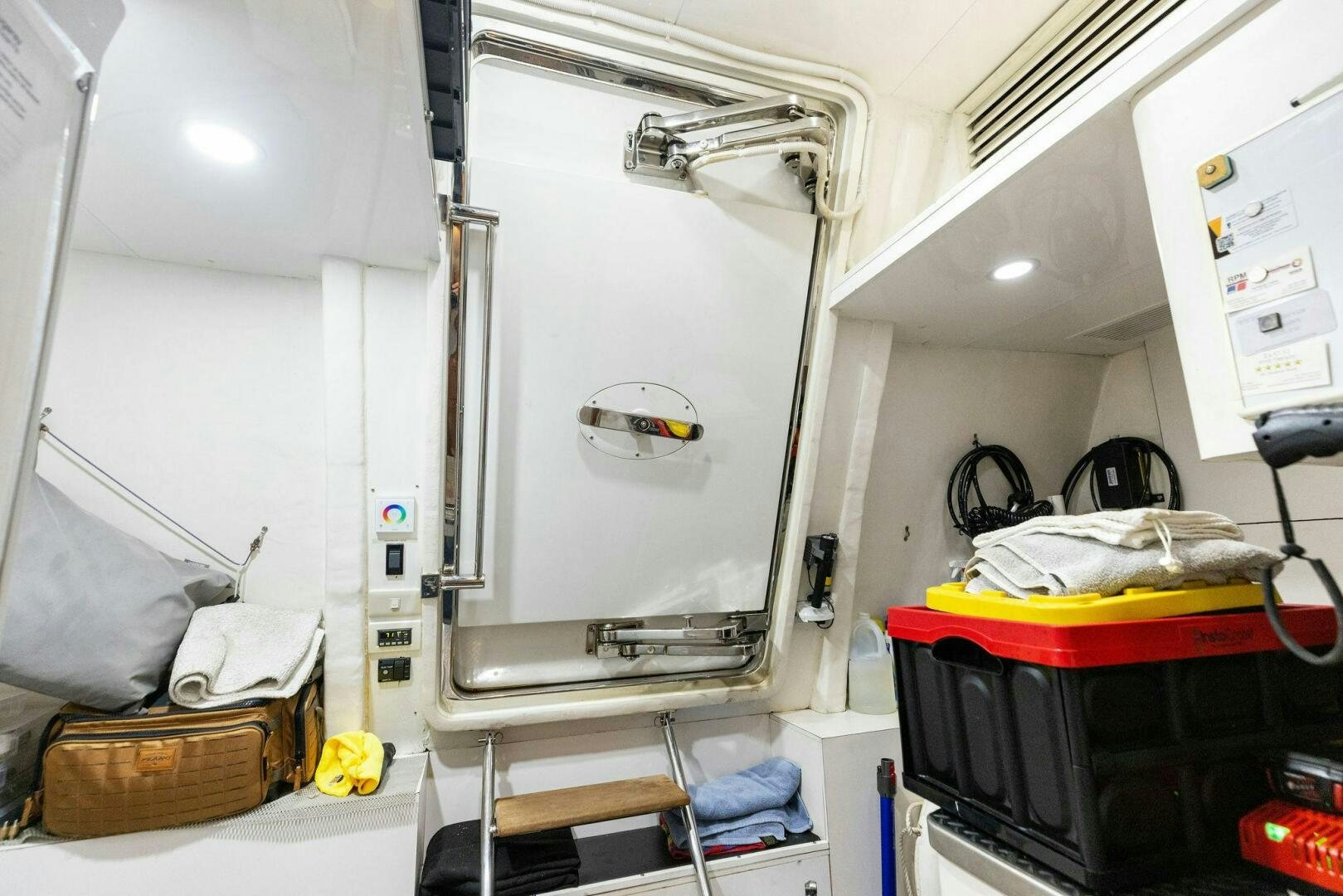 a room with a large mirror and luggage aboard SUNZSET Yacht for Sale