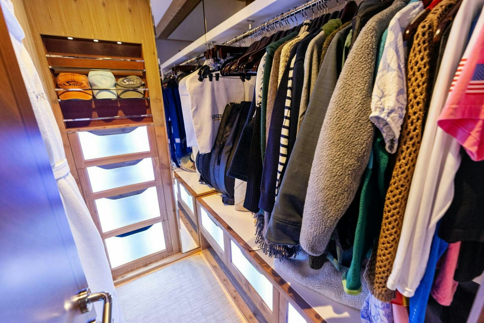 a closet full of clothes aboard SUNZSET Yacht for Sale