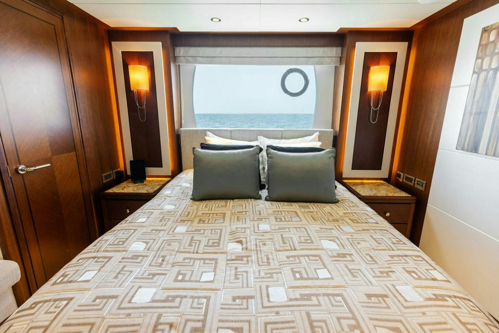 a bed with a large window aboard SUNZSET Yacht for Sale