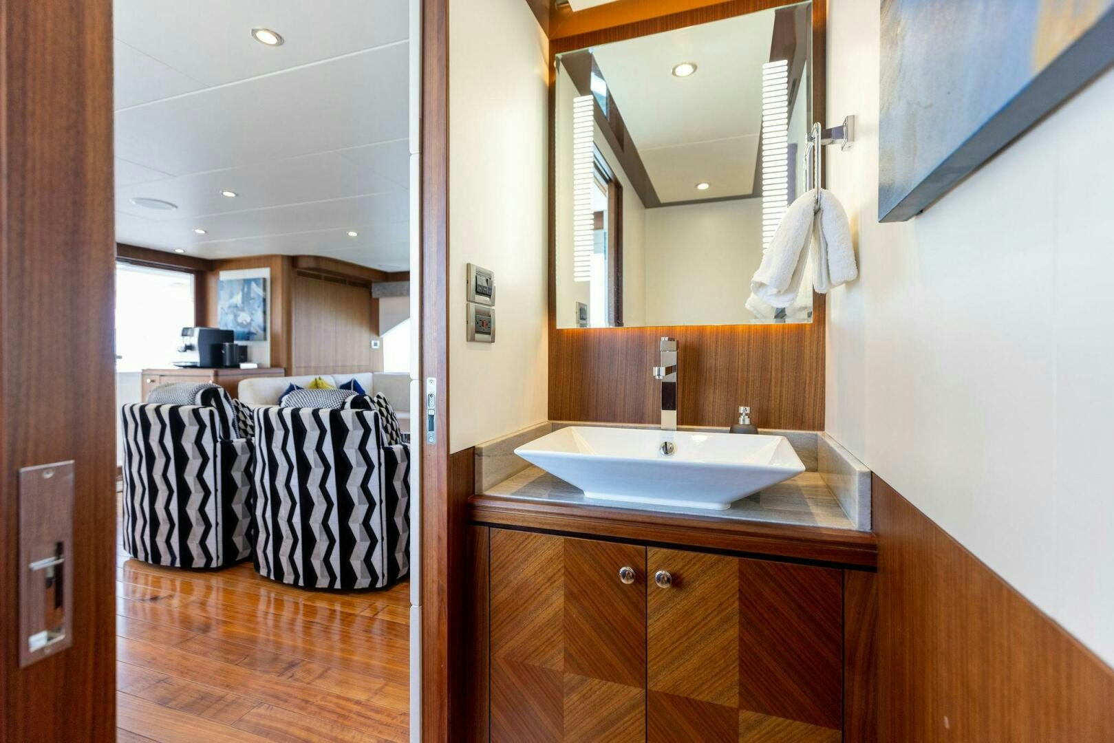 a bathroom with a sink and mirror aboard SUNZSET Yacht for Sale