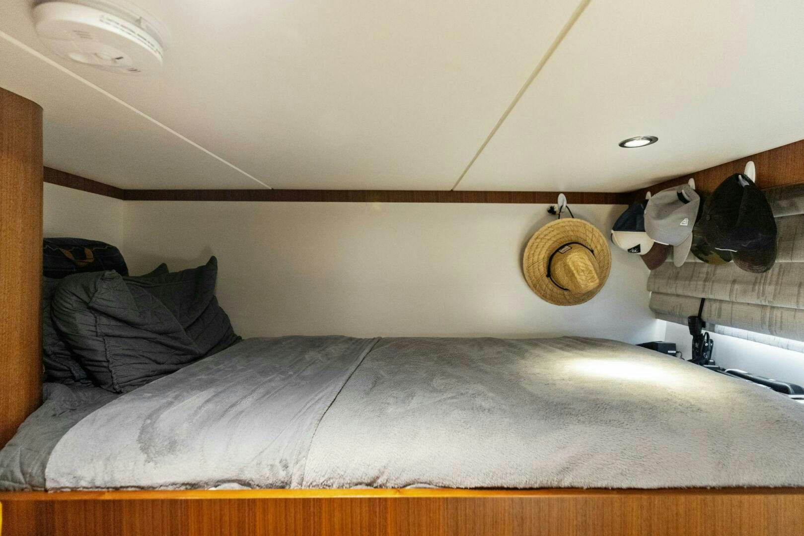 a bed with a brown pillow aboard SUNZSET Yacht for Sale