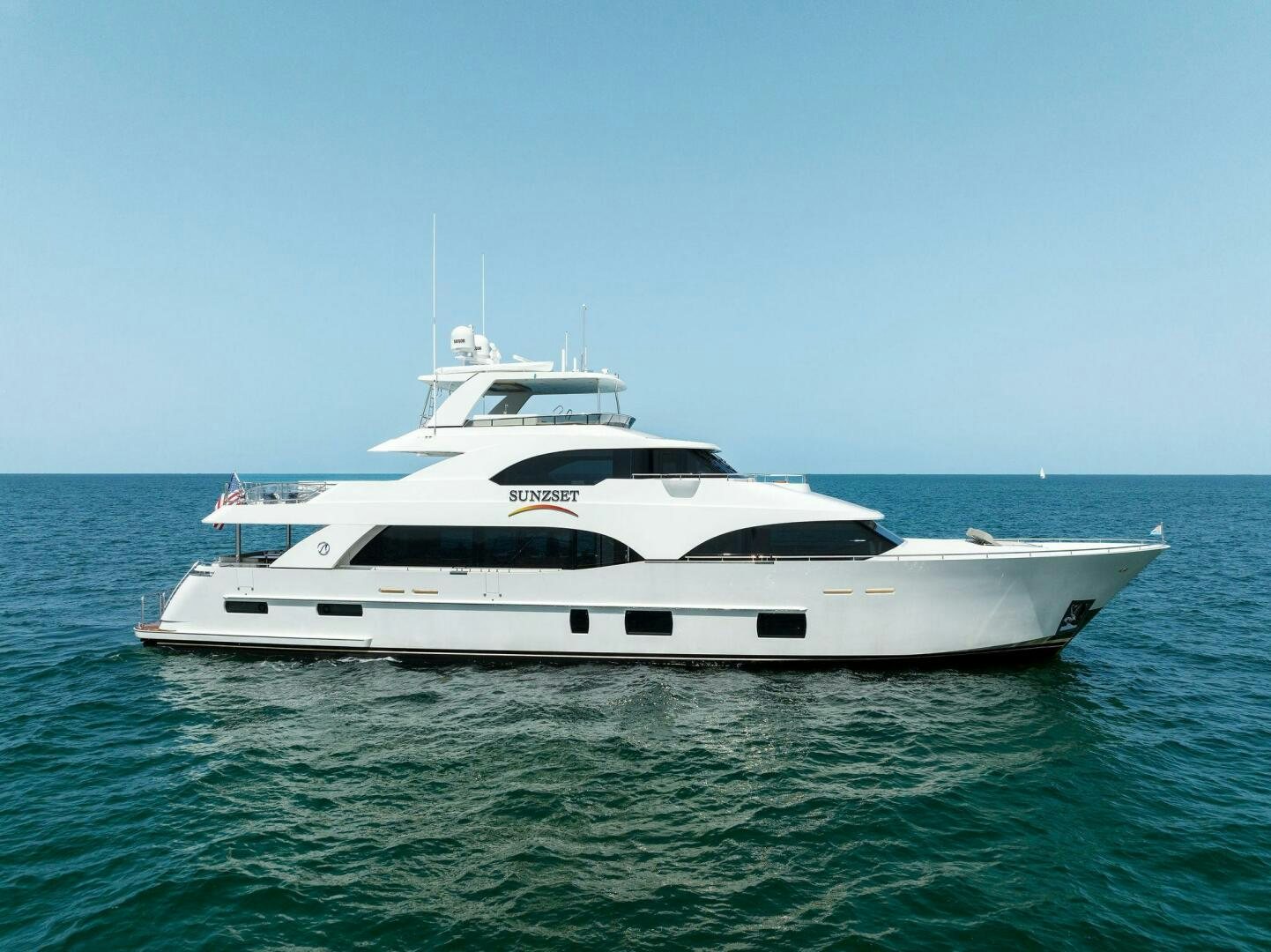 a white yacht in the water aboard SUNZSET Yacht for Sale