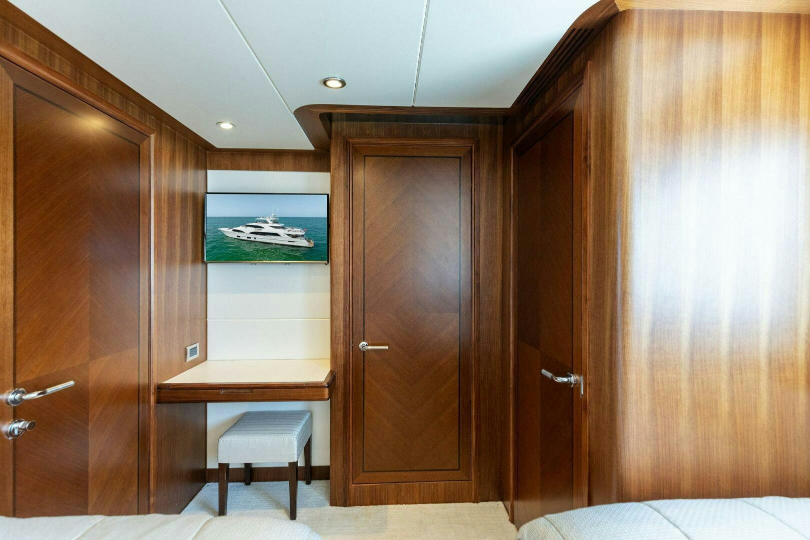 a room with wooden cabinets aboard SUNZSET Yacht for Sale