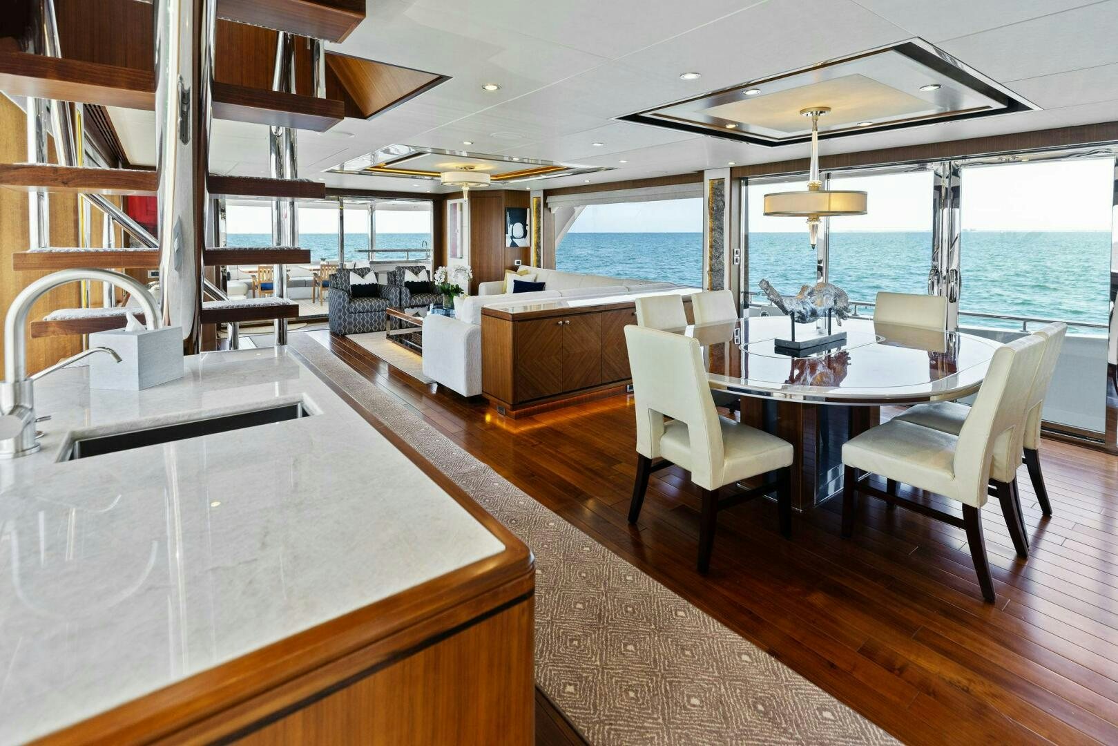 a large open kitchen and dining area aboard SUNZSET Yacht for Sale