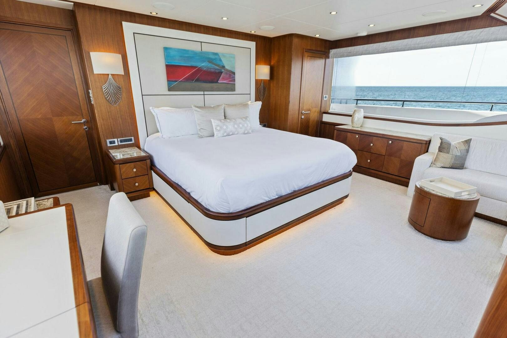 a hotel room with a bed and a chair aboard SUNZSET Yacht for Sale