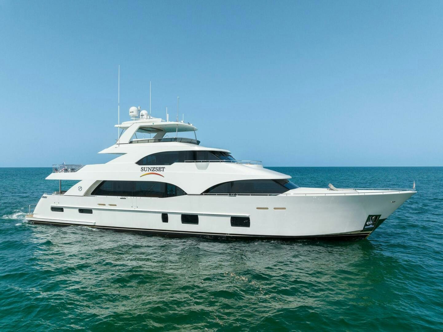 a white yacht in the water aboard SUNZSET Yacht for Sale